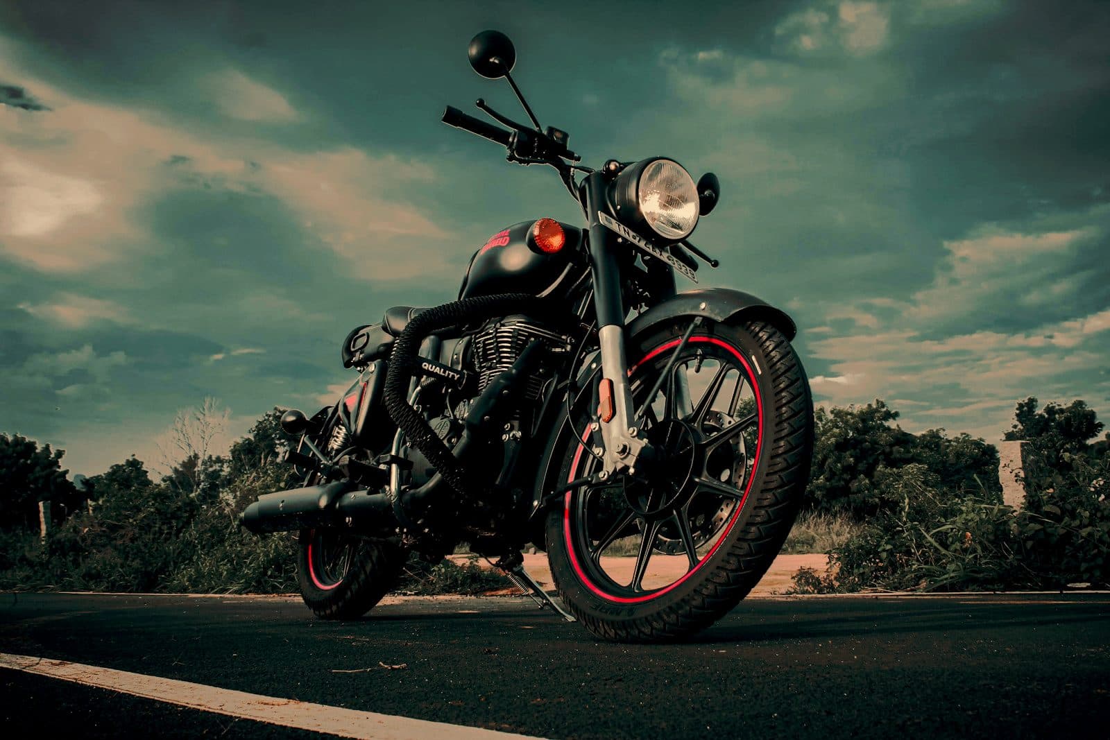 A Royal Enfield Hunter 350 shot low against an open sky