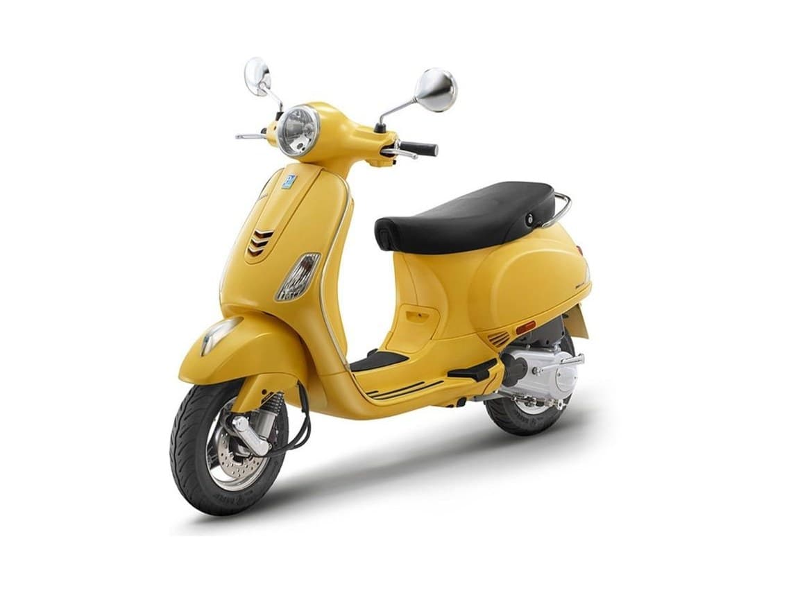 A yellow Vespa ZX 125 scooter, three-quarter view on a white background